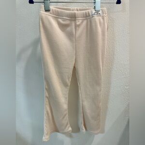 Soft stretch ribbed flare pants.